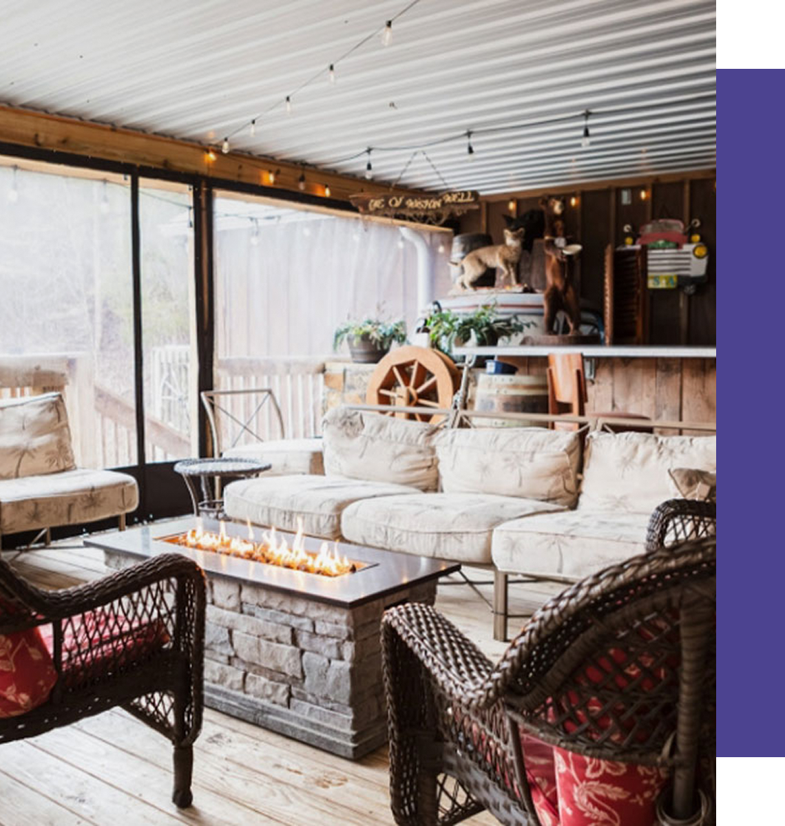 Cozy rustic sunroom with firepit and wicker seating