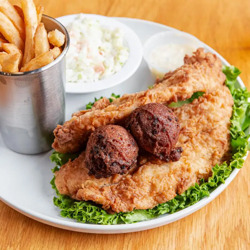 Fried catfish with hushpuppies and fries