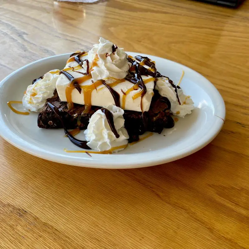Chocolate brownie sundae with whipped cream