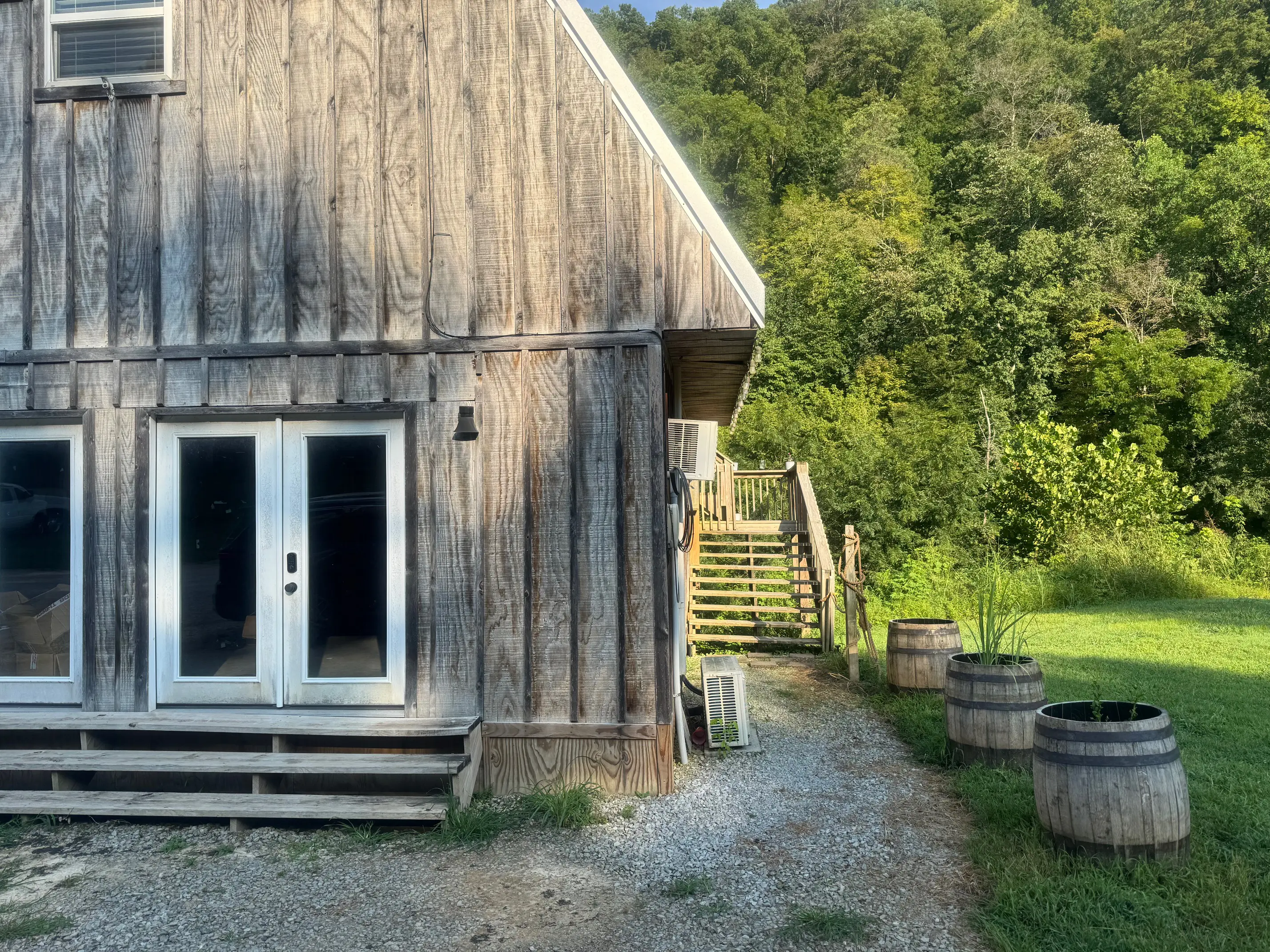 Wooden barn with glass doors and barrels