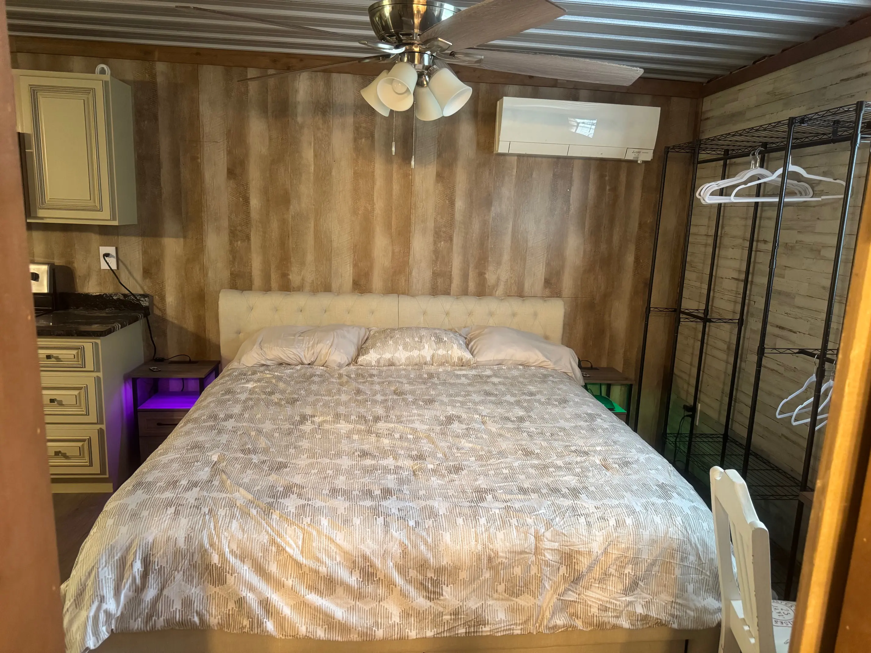 Cozy bedroom with king bed and air conditioner