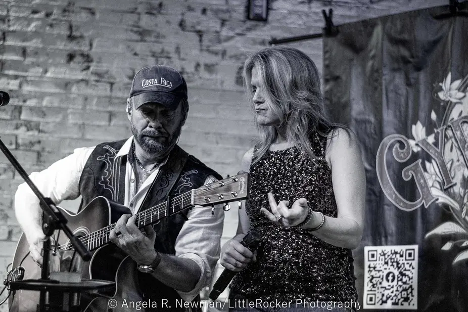 Male guitarist and female singer performing
