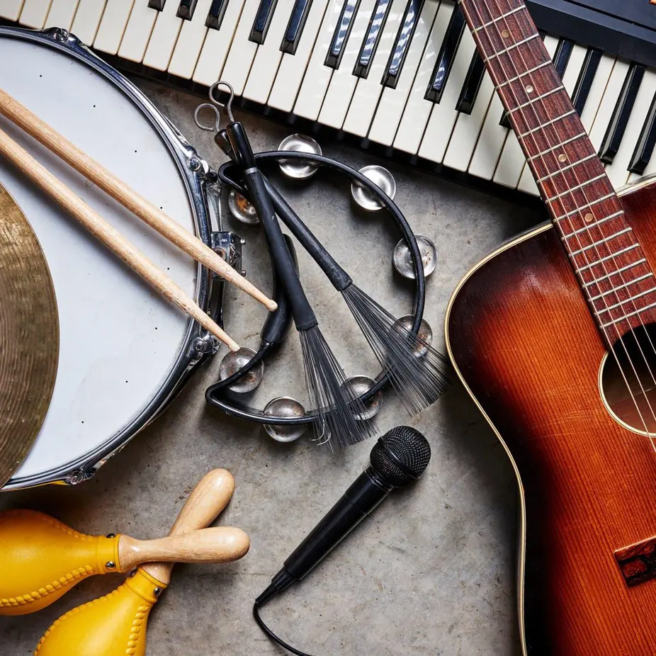 Assorted musical instruments: guitar, keyboard, microphone