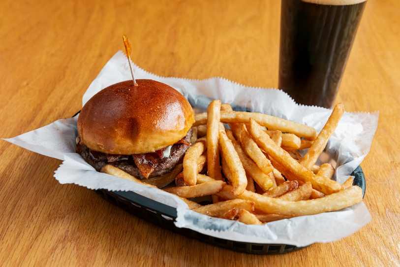 Burger and fries with dark beer